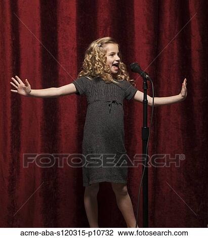 USA, Utah, Orem, Portrait of girl (8-9) singing with microphone View Large Photo Image Stock Image - USA, Utah, Orem, Portrait of girl (8-9) singing with microphone. Fotosearch