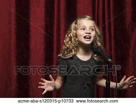 USA, Utah, Orem, Portrait of girl (8-9) singing with microphone View Large Photo Image Stock Image - USA, Utah, Orem, Portrait of girl (8-9) singing with microphone. Fotosearch