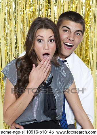 USA, Utah, Orem, Portrait of surprised young couple at party View Large Photo Image Stock Photography - USA, Utah, Orem, Portrait of surprised young couple at party. Fotosearch