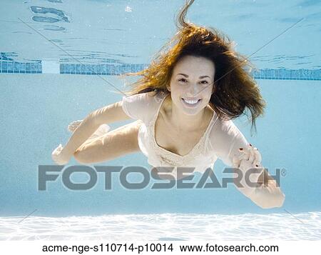 Picture - USA, Utah, Orem, Portrait of young woman under water. Fotosearch