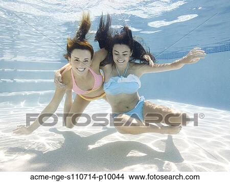 USA, Utah, Orem, Portrait of young women under water View Large Photo Image Picture - USA, Utah, Orem, Portrait of young women under water. Fotosearch
