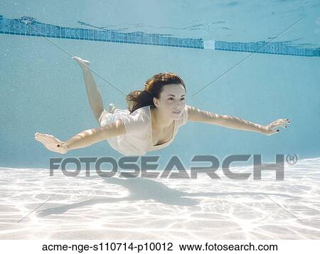 USA, Utah, Orem, Portrait of young woman under water View Large Photo Image Stock Image - USA, Utah, Orem, Portrait of young woman under water. Fotosearch