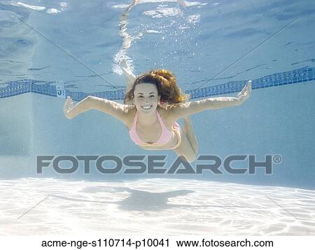 USA, Utah, Orem, Portrait of young woman under water View Large Photo Image Stock Image - USA, Utah, Orem, Portrait of young woman under water. Fotosearch