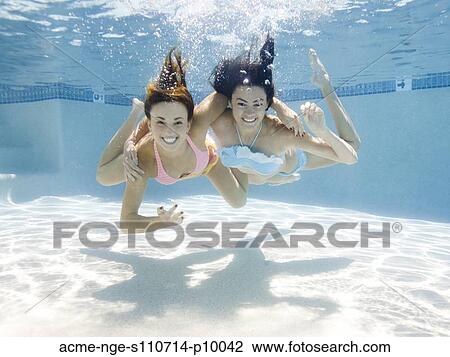 USA, Utah, Orem, Portrait of young women under water View Large Photo Image Stock Image - USA, Utah, Orem, Portrait of young women under water. Fotosearch