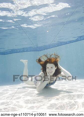 USA, Utah, Orem, Portrait of young woman under water View Large Photo Image Stock Image - USA, Utah, Orem, Portrait of young woman under water. Fotosearch