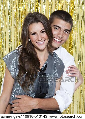 USA, Utah, Orem, Portrait of young couple smiling at party View Large Photo Image Stock Image - USA, Utah, Orem, Portrait of young couple smiling at party. Fotosearch
