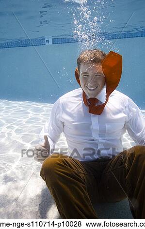 USA, Utah, Orem, Portrait of young groom under water View Large Photo Image Stock Photo - USA, Utah, Orem, Portrait of young groom under water. Fotosearch