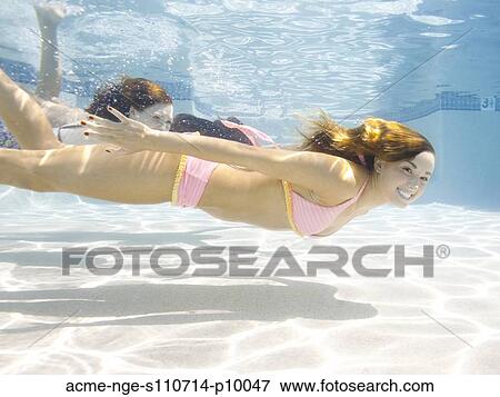 USA, Utah, Orem, Portrait of young women under water View Large Photo Image Stock Photo - USA, Utah, Orem, Portrait of young women under water. Fotosearch