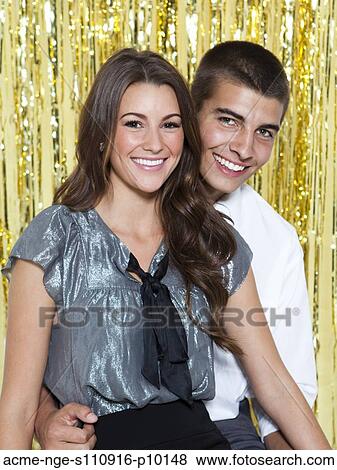 USA, Utah, Orem, Portrait of young couple smiling at party View Large Photo Image Stock Photo - USA, Utah, Orem, Portrait of young couple smiling at party. Fotosearch