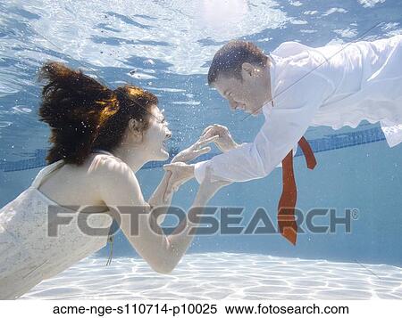 USA, Utah, Orem, Wedding couple under water View Large Photo Image Stock Photography - USA, Utah, Orem, Wedding couple under water. Fotosearch