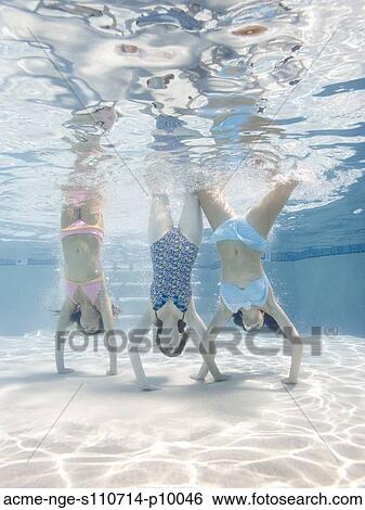 USA, Utah, Orem, Women doing handstand under water View Large Photo Image Stock Photograph - USA, Utah, Orem, Women doing handstand under water. Fotosearch