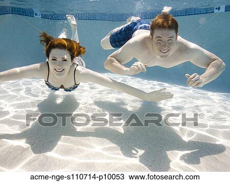 USA, Utah, Orem, Young couple under water View Large Photo Image Stock Image - USA, Utah, Orem, Young couple under water. Fotosearch