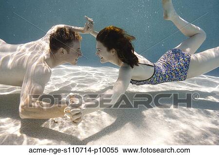 USA, Utah, Orem, Young couple under water View Large Photo Image Stock Photography - USA, Utah, Orem, Young couple under water. Fotosearch