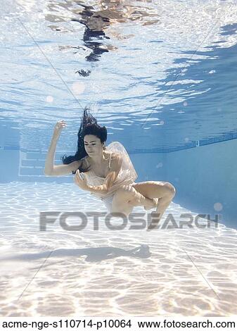 USA, Utah, Orem, Young woman in pool ballet dancing View Large Photo Image Picture - USA, Utah, Orem, Young woman in pool ballet dancing. Fotosearch