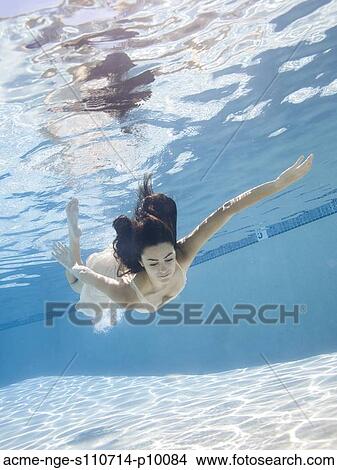 USA, Utah, Orem, Young woman in pool ballet dancing View Large Photo Image Picture - USA, Utah, Orem, Young woman in pool ballet dancing. Fotosearch