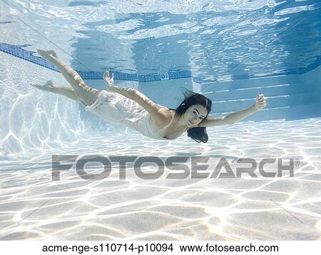 USA, Utah, Orem, Young woman in pool ballet dancing View Large Photo Image Picture - USA, Utah, Orem, Young woman in pool ballet dancing. Fotosearch