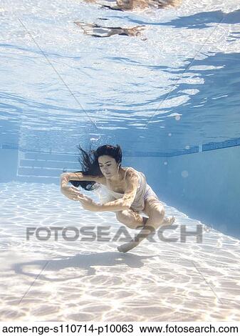 USA, Utah, Orem, Young woman in pool ballet dancing View Large Photo Image Stock Image - USA, Utah, Orem, Young woman in pool ballet dancing. Fotosearch