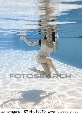 USA, Utah, Orem, Young woman in pool ballet dancing View Large Photo Image Stock Image - USA, Utah, Orem, Young woman in pool ballet dancing. Fotosearch