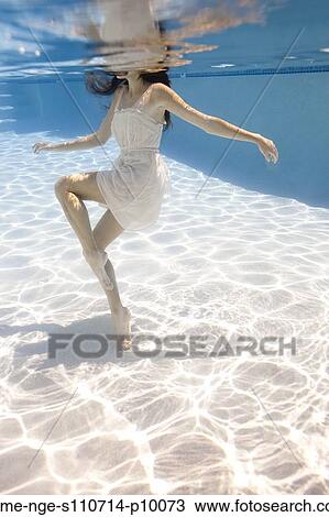 USA, Utah, Orem, Young woman in pool ballet dancing View Large Photo Image Stock Image - USA, Utah, Orem, Young woman in pool ballet dancing. Fotosearch