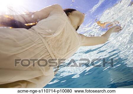 USA, Utah, Orem, Young woman in pool ballet dancing View Large Photo Image Stock Image - USA, Utah, Orem, Young woman in pool ballet dancing. Fotosearch