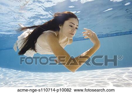 USA, Utah, Orem, Young woman in pool ballet dancing View Large Photo Image Stock Image - USA, Utah, Orem, Young woman in pool ballet dancing. Fotosearch