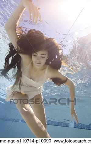 USA, Utah, Orem, Young woman in pool ballet dancing View Large Photo Image Stock Image - USA, Utah, Orem, Young woman in pool ballet dancing. Fotosearch