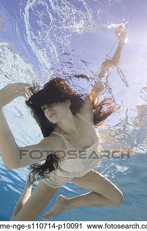 USA, Utah, Orem, Young woman in pool ballet dancing View Large Photo Image Stock Image - USA, Utah, Orem, Young woman in pool ballet dancing. Fotosearch