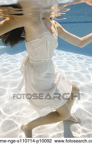 USA, Utah, Orem, Young woman in pool ballet dancing View Large Photo Image Stock Image - USA, Utah, Orem, Young woman in pool ballet dancing. Fotosearch