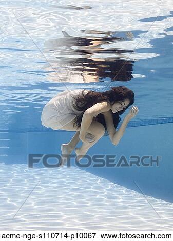 USA, Utah, Orem, Young woman in pool ballet dancing View Large Photo Image Stock Photo - USA, Utah, Orem, Young woman in pool ballet dancing. Fotosearch