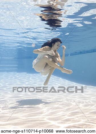 USA, Utah, Orem, Young woman in pool ballet dancing View Large Photo Image Stock Photo - USA, Utah, Orem, Young woman in pool ballet dancing. Fotosearch