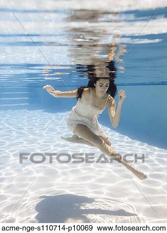 USA, Utah, Orem, Young woman in pool ballet dancing View Large Photo Image Stock Photo - USA, Utah, Orem, Young woman in pool ballet dancing. Fotosearch