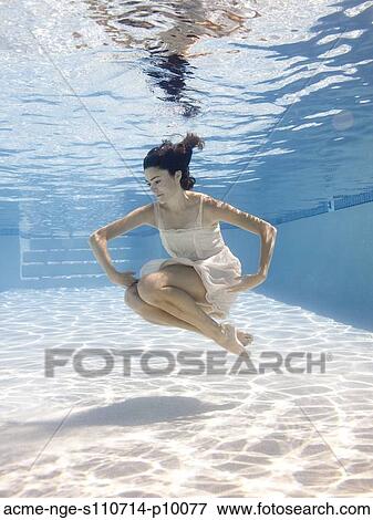 USA, Utah, Orem, Young woman in pool ballet dancing View Large Photo Image Stock Photo - USA, Utah, Orem, Young woman in pool ballet dancing. Fotosearch