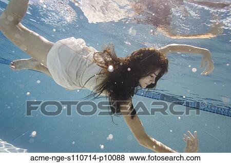 USA, Utah, Orem, Young woman in pool ballet dancing View Large Photo Image Stock Photo - USA, Utah, Orem, Young woman in pool ballet dancing. Fotosearch