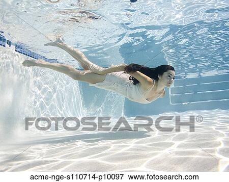 USA, Utah, Orem, Young woman in pool ballet dancing View Large Photo Image Stock Photo - USA, Utah, Orem, Young woman in pool ballet dancing. Fotosearch
