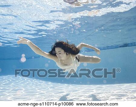 USA, Utah, Orem, Young woman in pool ballet dancing View Large Photo Image Stock Photograph - USA, Utah, Orem, Young woman in pool ballet dancing. Fotosearch