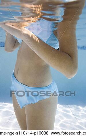 USA, Utah, Orem, Young woman standing under water View Large Photo Image Stock Photo - USA, Utah, Orem, Young woman standing under water. Fotosearch