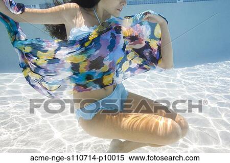 USA, Utah, Orem, Young woman under water wrapped in colorful textile View Large Photo Image Stock Photography - USA, Utah, Orem, Young woman under water wrapped in colorful textile. Fotosearch