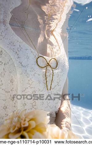 USA, Utah, Orem, Young woman with bouquet under water View Large Photo Image Stock Image - USA, Utah, Orem, Young woman with bouquet under water. Fotosearch