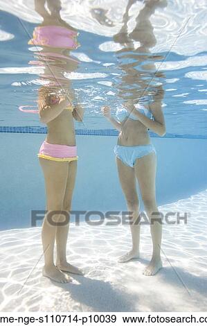 USA, Utah, Orem, Young women standing under water View Large Photo Image Stock Photo - USA, Utah, Orem, Young women standing under water. Fotosearch