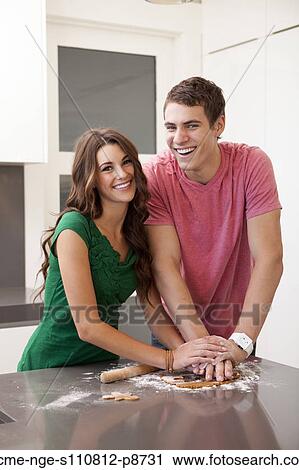 Young couple preparing gingerbread cookies View Large Photo Image Stock Image - Young couple preparing gingerbread cookies. Fotosearch