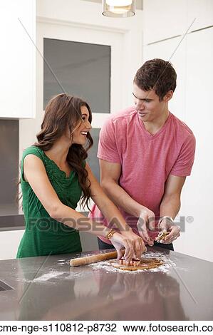 Young couple preparing gingerbread cookies View Large Photo Image Stock Image - Young couple preparing gingerbread cookies. Fotosearch