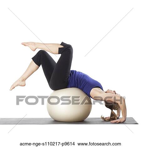 Young pregnant woman exercising with fitness ball, studio shot View Large Photo Image Picture - Young pregnant woman exercising with fitness ball, studio shot. Fotosearch