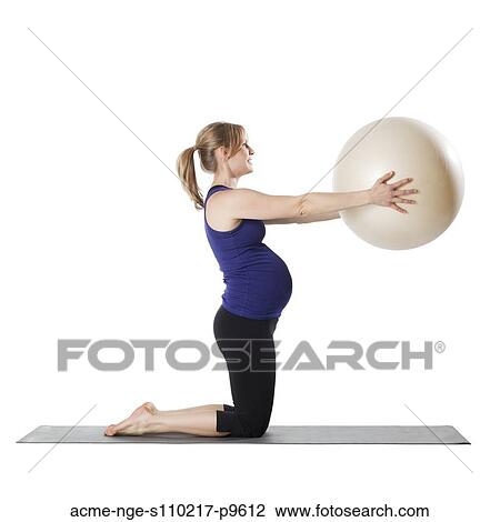Young pregnant woman exercising with fitness ball, studio shot View Large Photo Image Stock Image - Young pregnant woman exercising with fitness ball, studio shot. Fotosearch