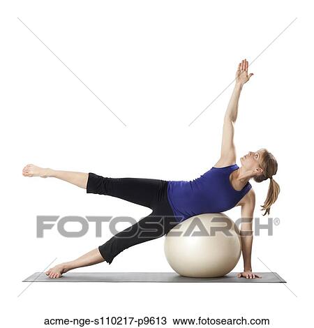 Young pregnant woman exercising with fitness ball, studio shot View Large Photo Image Stock Image - Young pregnant woman exercising with fitness ball, studio shot. Fotosearch