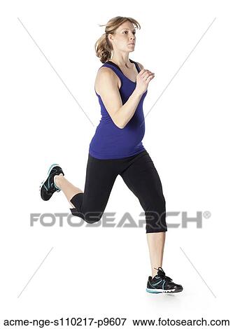 Young pregnant woman in sports clothing running, studio shot View Large Photo Image Stock Photo - Young pregnant woman in sports clothing running, studio shot. Fotosearch