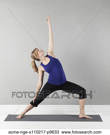 Young pregnant woman practicing yoga, studio shot View Large Photo Image Stock Image - Young pregnant woman practicing yoga, studio shot. Fotosearch