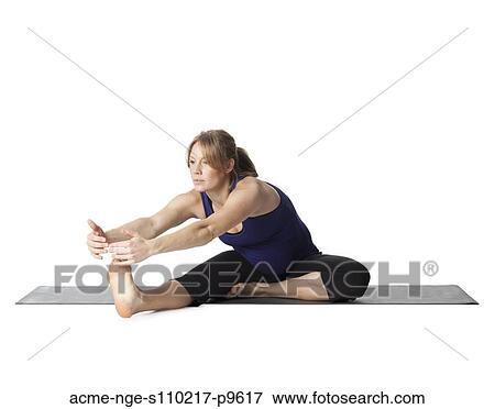 Young pregnant woman practicing yoga, studio shot View Large Photo Image Stock Photo - Young pregnant woman practicing yoga, studio shot. Fotosearch