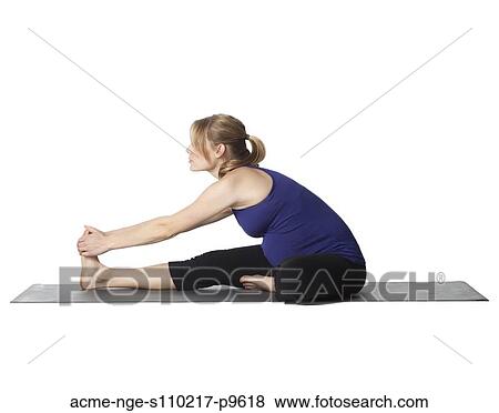 Young pregnant woman practicing yoga, studio shot View Large Photo Image Stock Photo - Young pregnant woman practicing yoga, studio shot. Fotosearch