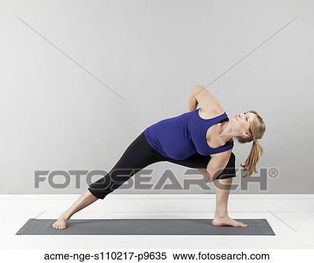 Young pregnant woman practicing yoga, studio shot View Large Photo Image Stock Photography - Young pregnant woman practicing yoga, studio shot. Fotosearch
