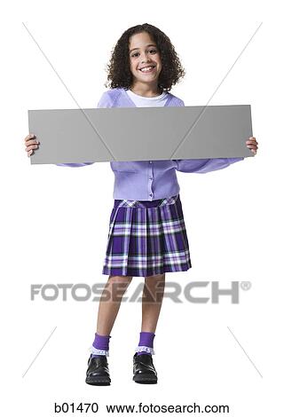 Stock Image - Portrait of a girl holding a blank sign. Fotosearch